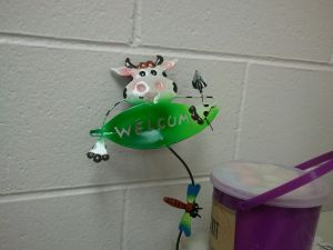 cow with welcome sign